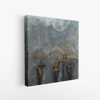 Side view of abstract textured canvas art featuring layered grey surface and raised gold umbrella figures, highlighting depth and material detail.
