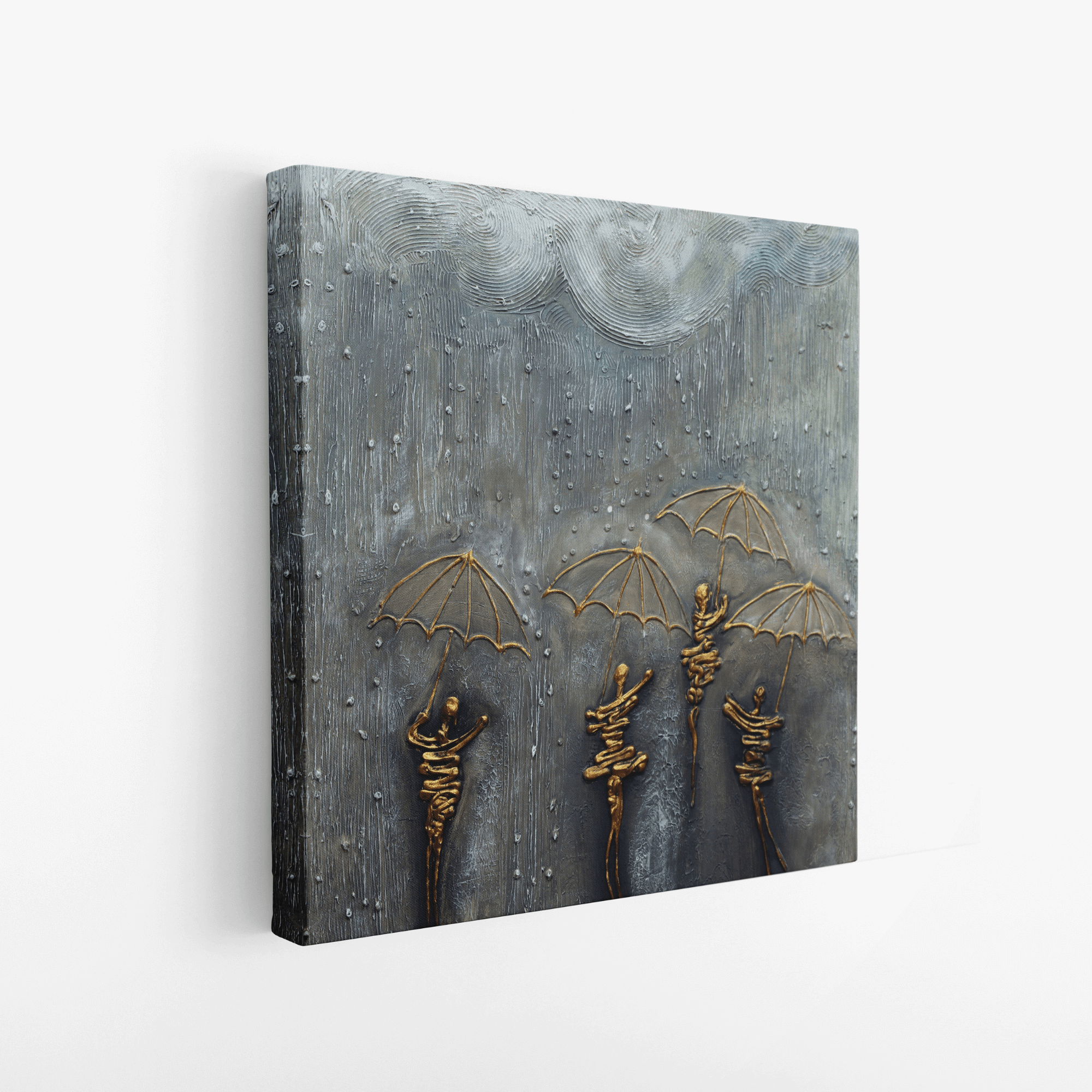 Side view of abstract textured canvas art featuring layered grey surface and raised gold umbrella figures, highlighting depth and material detail.